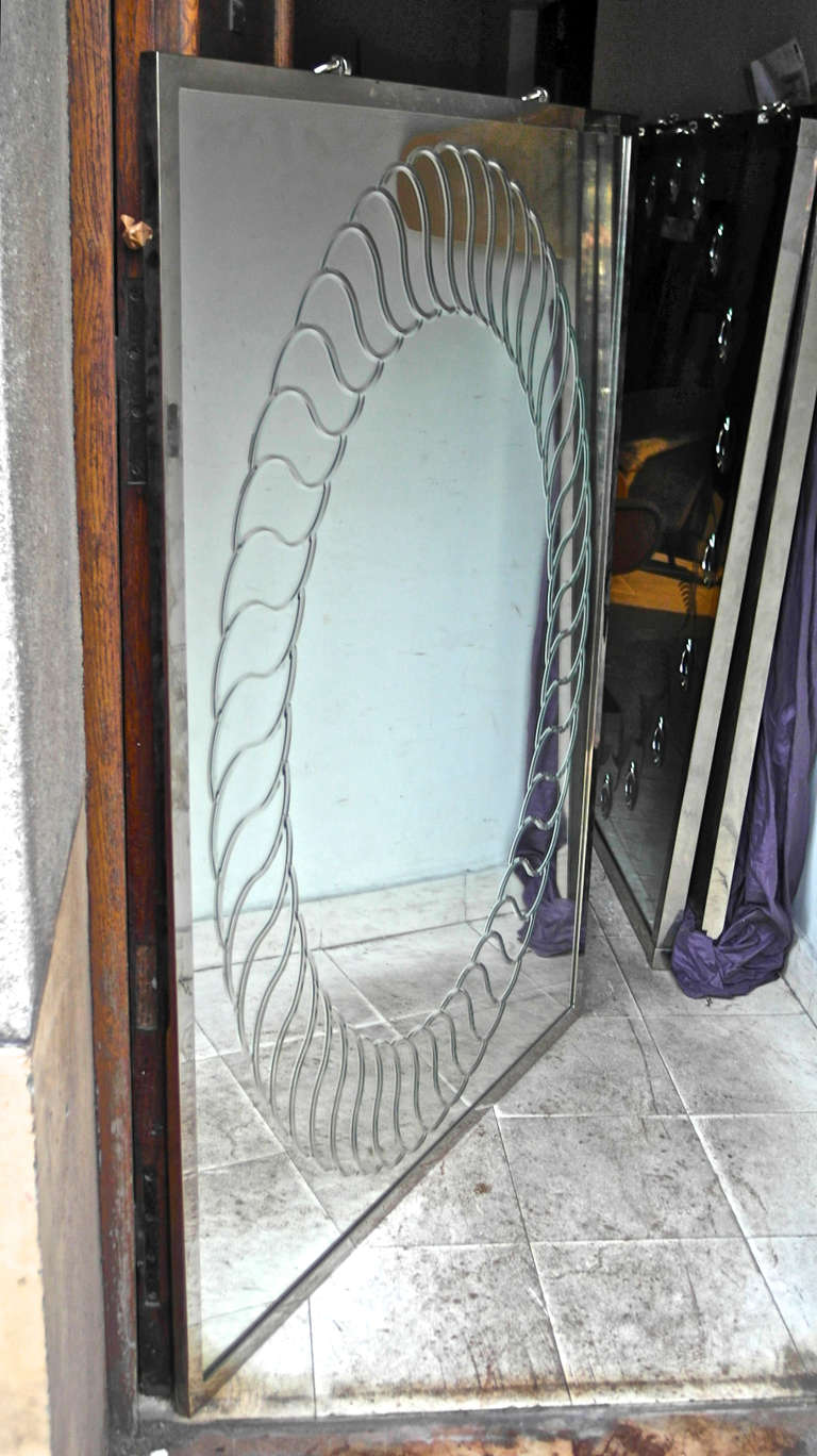 Pair of spectacular contemporary engraved mirror by Andre Hayat with nickeled frame and hanging rings.