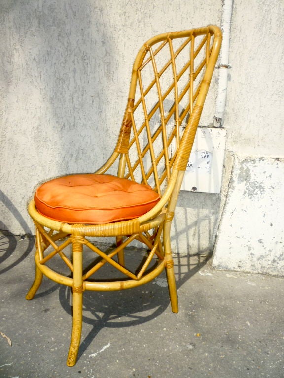 Louis Sognot rattan chair in the 1950s Riviera style.