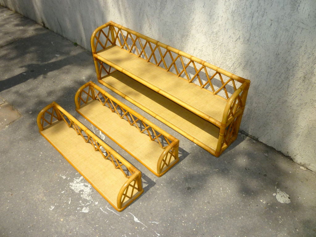 Louis Sognot charming set of three shelves in rattan from the 1950s Riviera style.