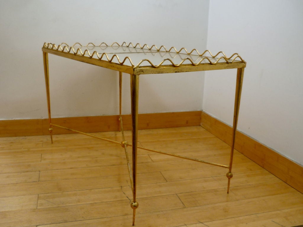 Rene Prou 
charming wrought iron table with two movable serving trays.