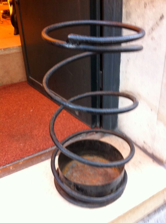 JEAN ROYERE <br />
extremely rare umbrella stand in black wrought iron documented in<br />
 