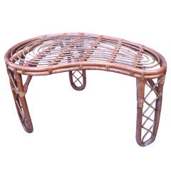 JEAN ROYERE attributed kidney rattan tri-legged coffee table