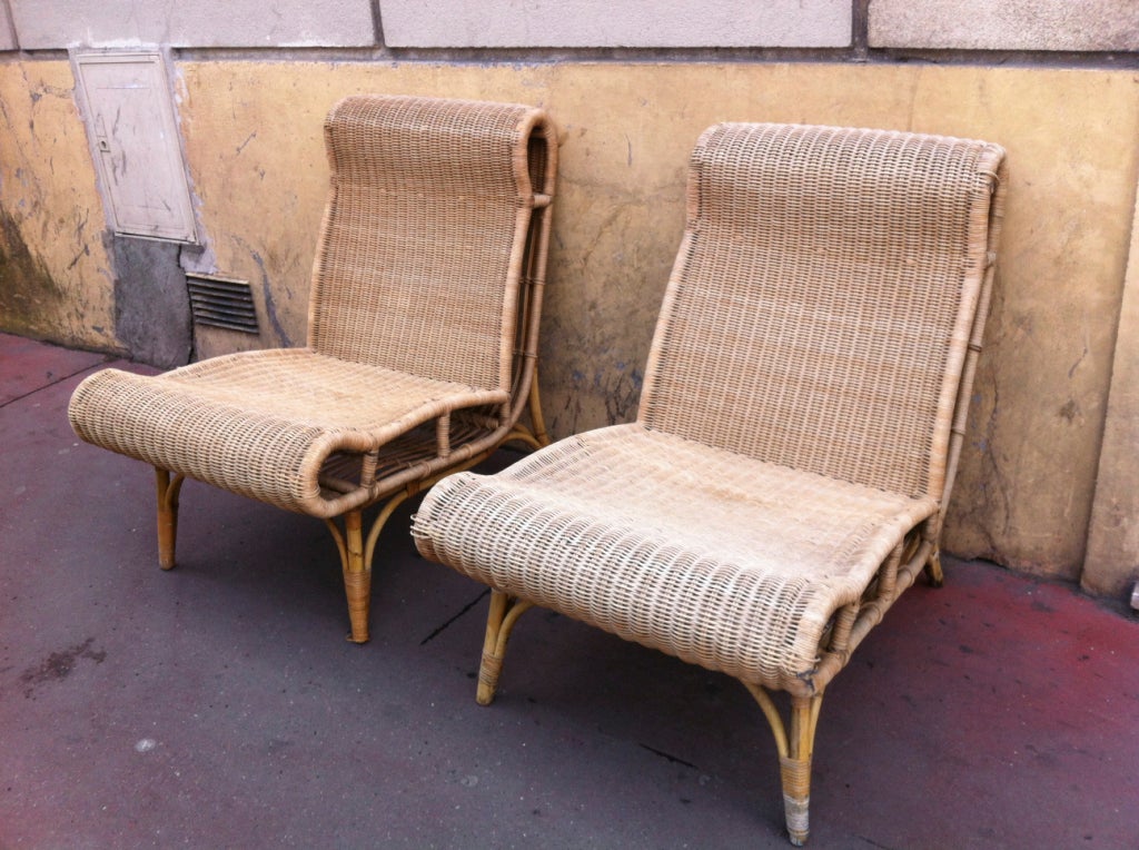 Abraham and Rol very rare pair of rattan slipper chairs in vintage condition.