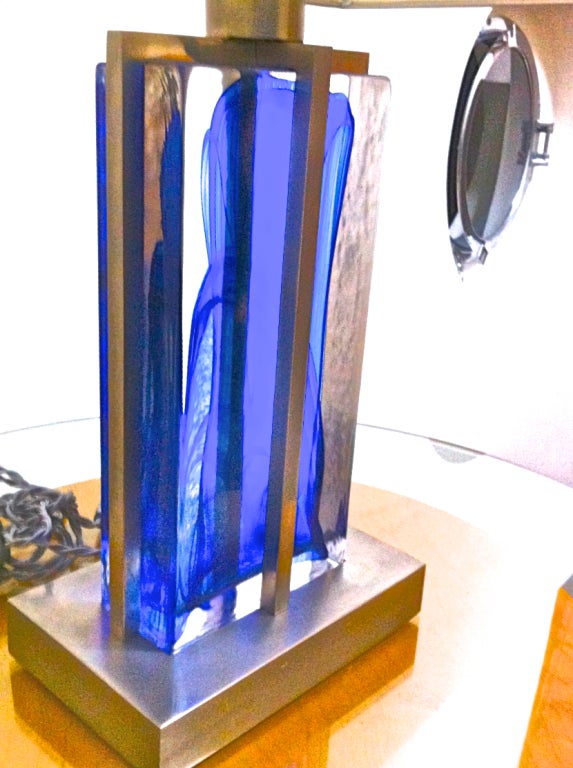 1990s brushed steel and heavy blue glass block pair of lamps.