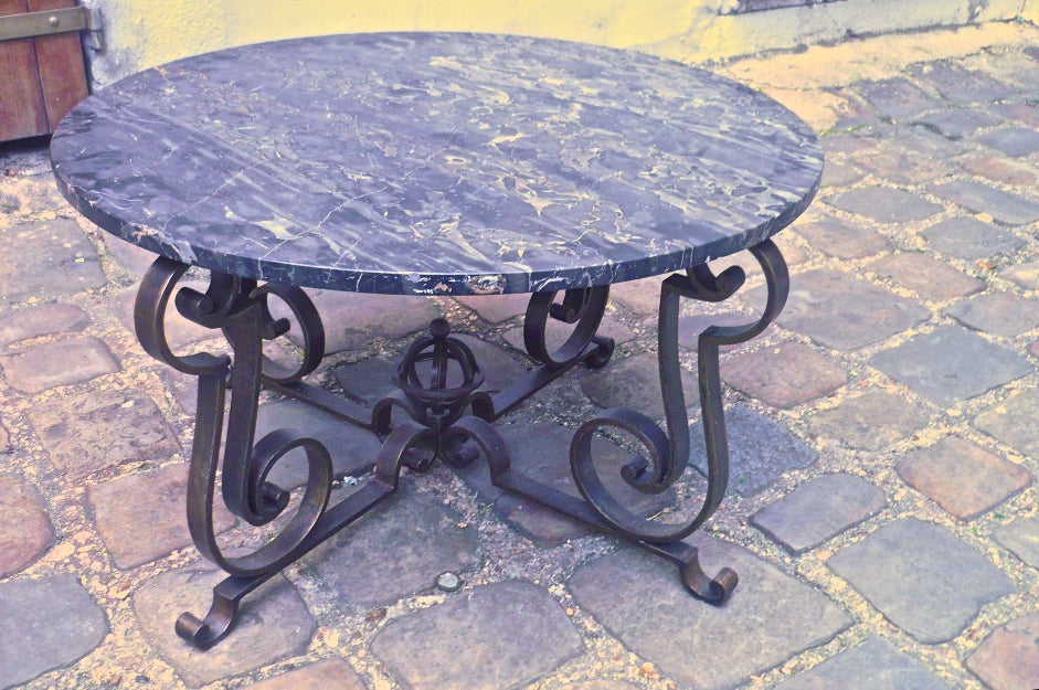 Gilbert Poillerat attributed astrolable coffee table in wrought iron and marble-top.