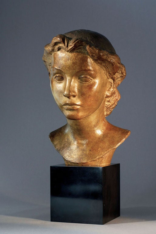 Gold patinated original bronze proof figuring the bust of a young lady. The latter stands on a Belgium black marble base.  Signed : Androusov on the side