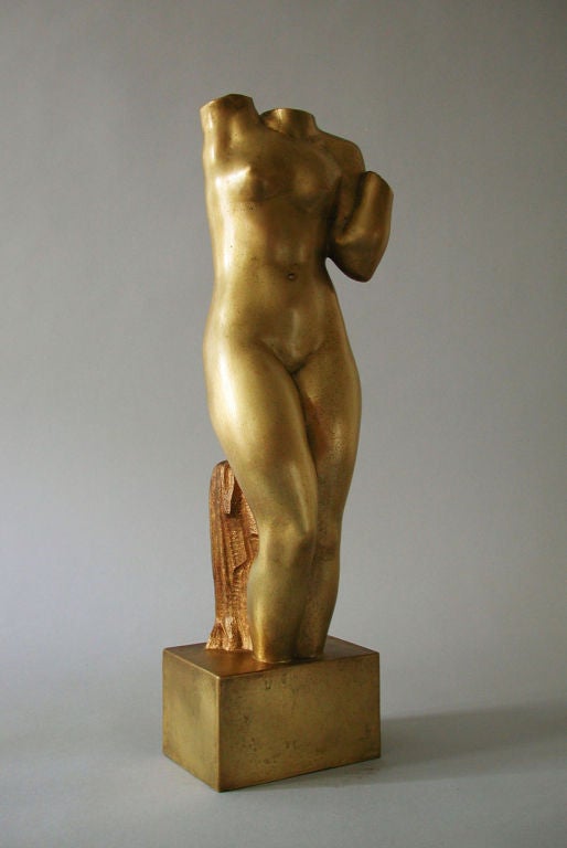 Bronze proof sculpture representing the body of a naked woman. Cut at the ankles and neck, this nude is particular for the specific movement of his arms. One of them is folded as if lifting a weight, while the other, even if cut at the shoulder