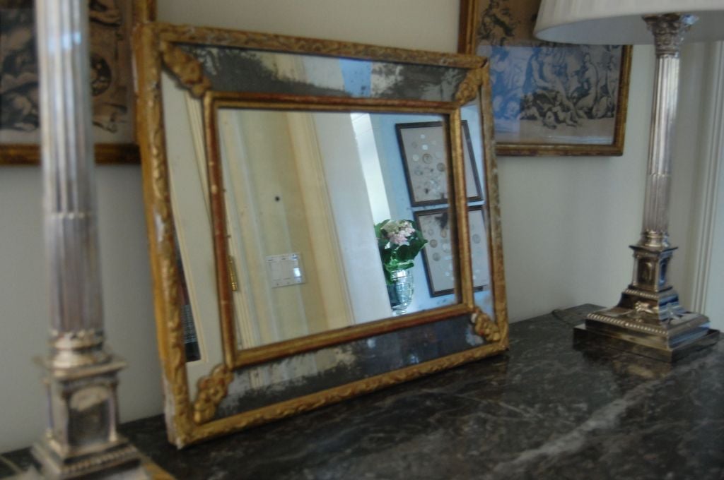 19th century French mirror a par clause with gently worn gold leaf frame and old glass.