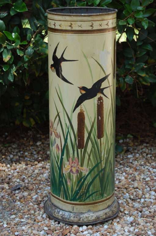 Unusual and charming hand-painted umbrella stand depicting rice birds, cattails and wild iris on a cream-colored background. Decorative gold detailing around top band and at base. 

8.5