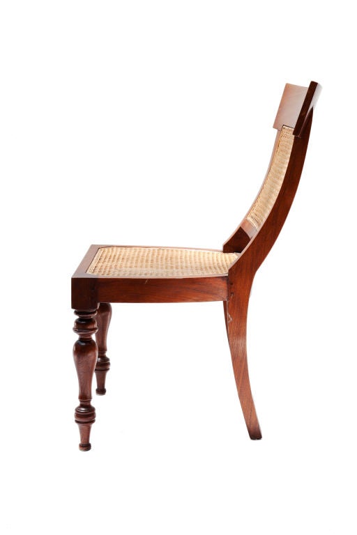 Six British colonial style mahogany side chairs with cane seats and backs on turned legs, with a pleasing and comfortable profile to back.