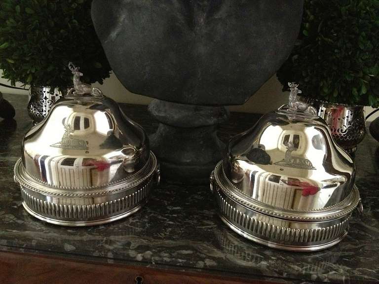 Descended through a Savannah estate, a pair of Sheffield domed food warmers, each warmer consisting of three pieces: the dome, the inside warming plate and the base holding hot water.
The silver has a wooden base (pictured); the dome is topped with