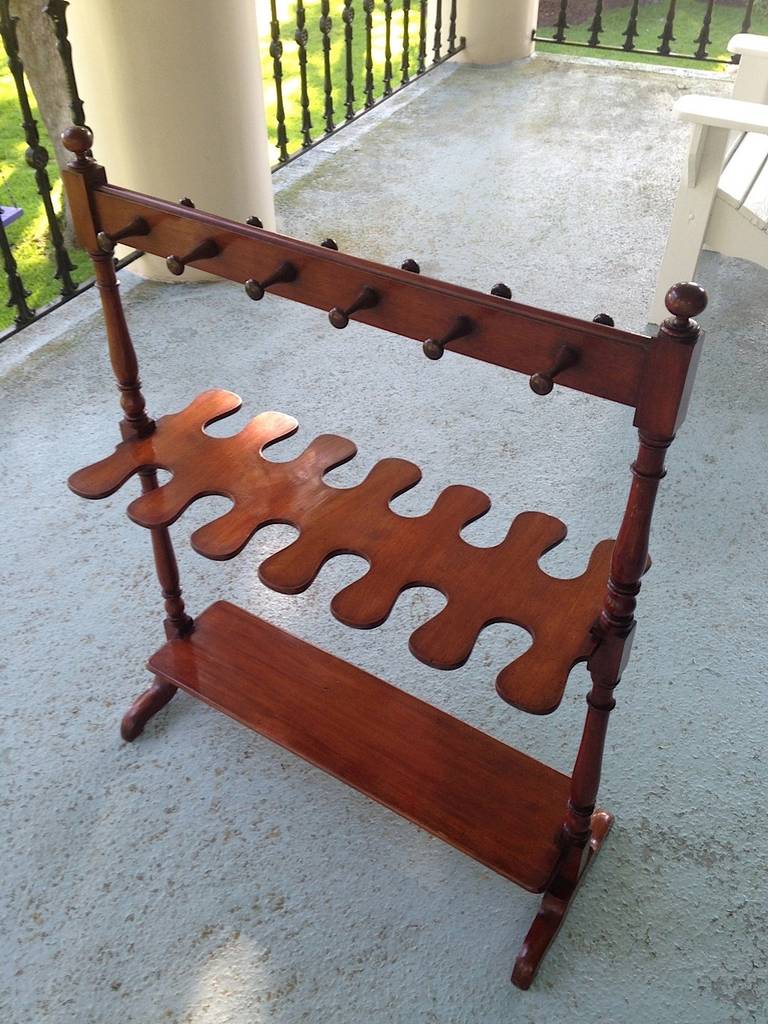 English mahogany boot rack with a beautiful patina and finish.  May be used in a hallway or (elegant) mud room or in a closet for shoe storage, umbrella or pocketbook storage.  