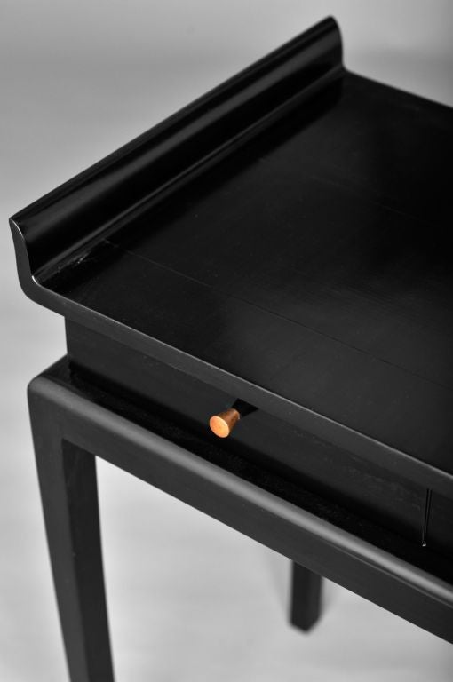 Top ended by a crown, evocating the japonese pagoda roofs<br />
2 drawers in front<br />
Darkened walnut wood<br />
Origin: Casa Pelizzari, Venice, 1942