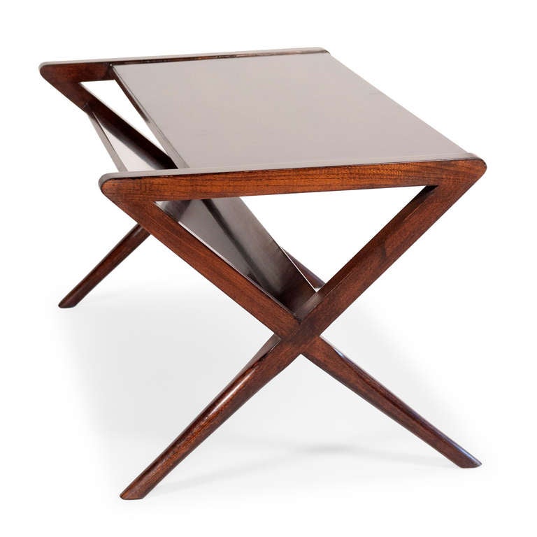 X-form leg mahogany coffee table, with rectangular surface, and angled open end magazine rack underside, American, 1950s. Designer unknown. 38 in x 19 in, height 16 in. (Item #1883)