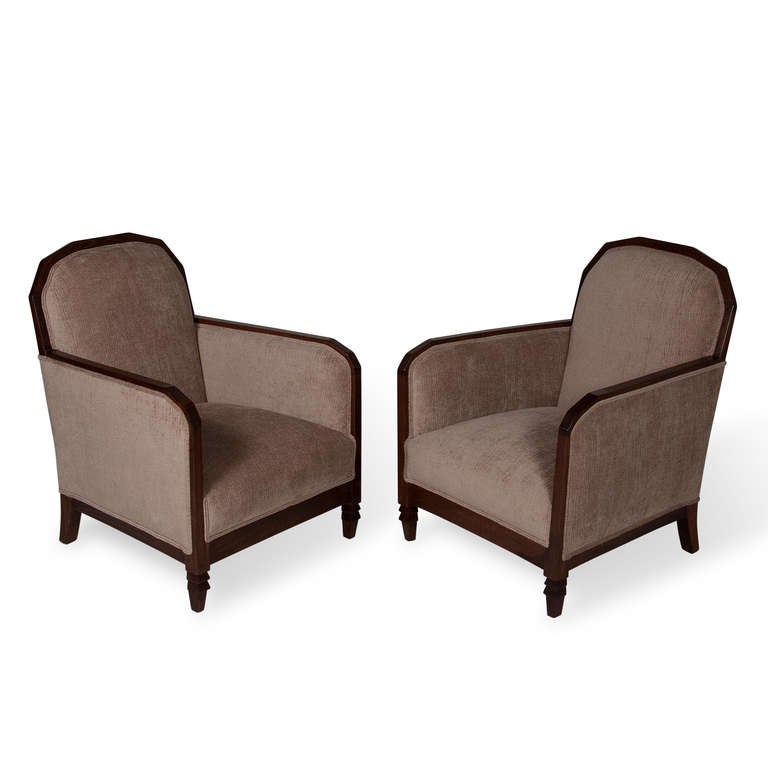 Pair of French walnut wood frame upholstered armchairs, with octagonal angled back, angled arms, and stepped flair on each front foot, newly upholstered in a Kravet blend. French 1930s, back height 33 1/2 in, seat height 15 in, width 26 in, depth 26
