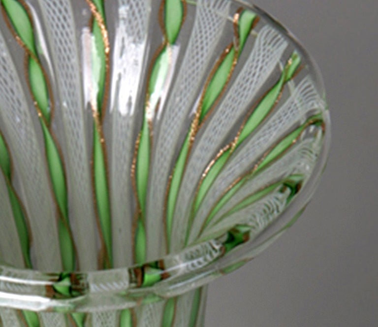 Pair of bulbous form glass vases with green and gold zanfirico and fine white latticino, flared rims, clear bases with gold inclusions. By AVEM, Murano, Italy 1960s. One retaining round red Made in Murano label, 4 in. largest diameter, 9.25 in.