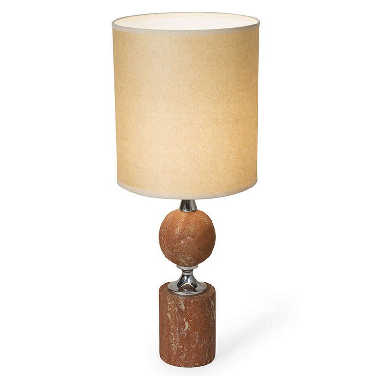 Rouge travertine and chrome table lamp, the circular column base surmounted by an spherical shape, in custom marbled paper shade, by Barbier, French 1970s. Overall height 22 1/2 in, shade measures diameter 9 in, height 10 in, base has 4 in diameter.