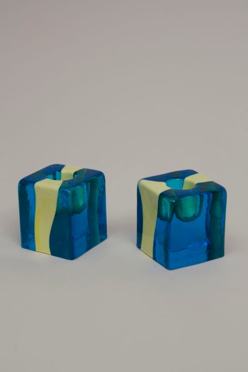 Pair of blue and yellow glass cube form candleholders, by Pierre Cardin for Venini, Italian 1969. Engraved signatures. Height 2 3/8 in, 2 in square.