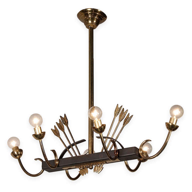 Black iron and bronze chandelier, a rectangular iron element from which extend 6 bronze arms, and having bronze arrows sticking up, French 1950s. Overall length 38 in (bulb to bulb), overall width 18 3/4 in, overall height 28 1/2 in, overall height