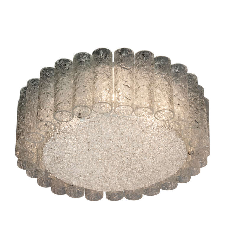 Flush mount textured glass chandelier, of overall circular form, a ring of glass cylinders around a central textured glass disc, by Doria, German, 1960s. Diameter 16 in, height 6 3/4 in. (Item #2039)