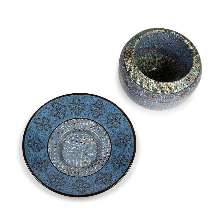 Two ceramic pieces - priced for the set of two. Also sold separately, please inquire. 

Large circular ceramic charger, the form built by ceramic mosaic elements in colors of blue, grey, black, and white, a central blue band over a speckled