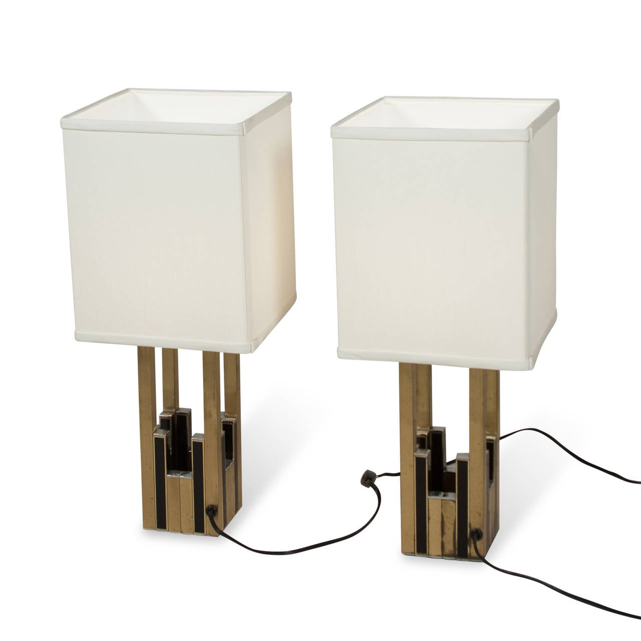 Brass and black lacquered brass table lamps, open rectangular column form with alternating black and brass elements by Lumica, Spanish, 1970s. Overall height 20 1/2 in, height of base to top of metal 10 in, base measures 3 3/4 in square. Shade