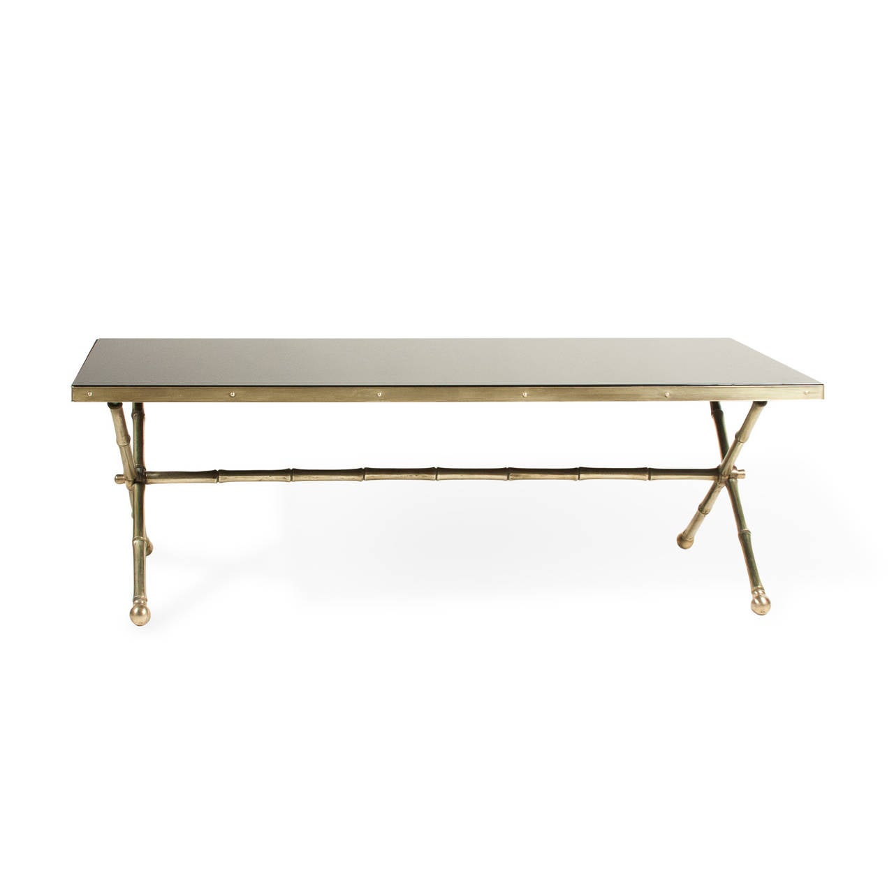 Rectangular black glass top coffee table, bronze faux bamboo frame, crossed legs at either end, with cross stretcher, French, 1960s. Length 40 in, width 19 1/2 in, height 13 in.