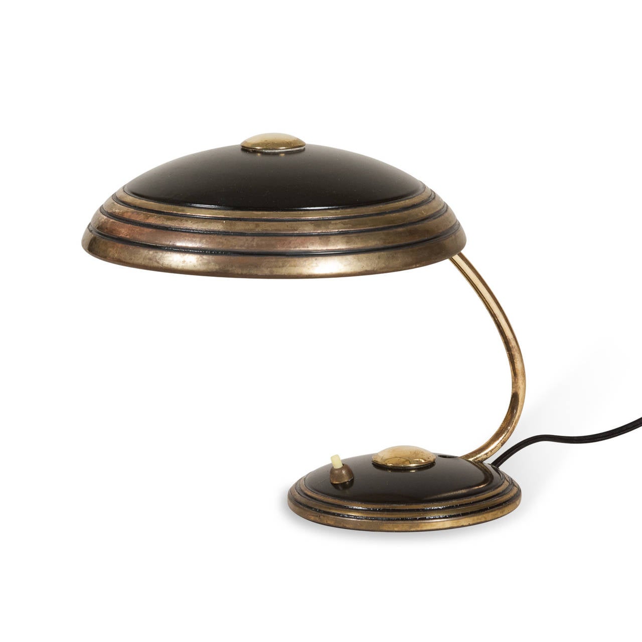 Patinated brass and black lacquered metal dome desk lamp, the shade as well as the arm pivoting up and down by Helo, German, 1950s. Signed to underside. Height in 9 1/2 in, diameter of shade 9 in. (Item #2288).