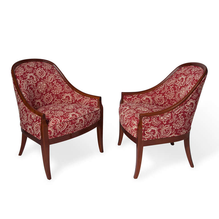 Pair of rounded and arched back armchairs, mahogany frame, newly upholstered in a red/beige floral cotton blend, attributed to Baker, American 1950s. Back height 32 in, width 24 in, depth 26 in. (Item #1738)
Price for the pair.