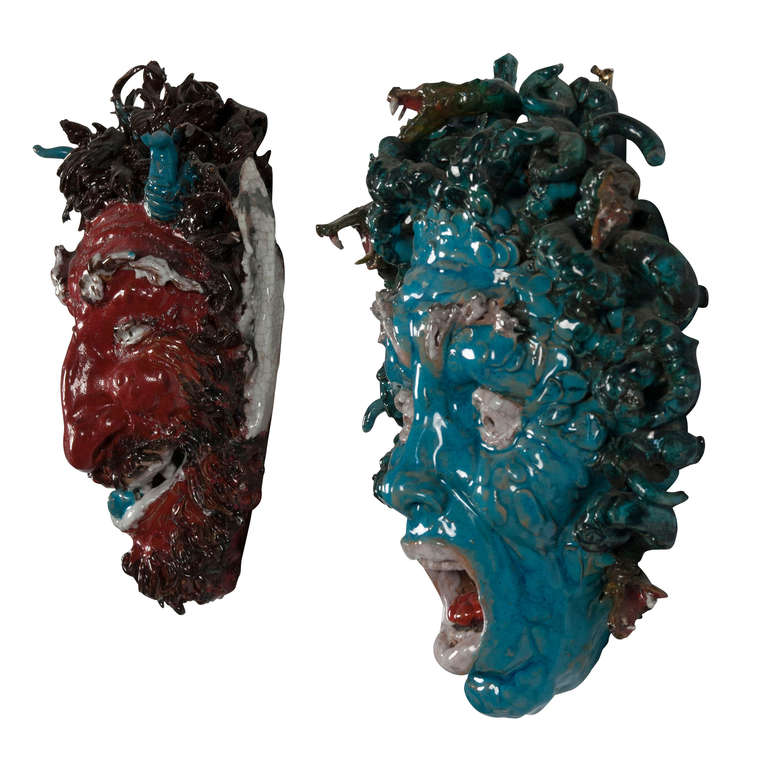Two mythological ceramic wall mounted masks by Eugenio Pattarino. Sold separately or as a set. 
On left: Sculptural glazed ceramic head of a mythological medusa, green visage with serpent hair, by Eugenio Pattarino (b.1885-1971), Italian, 1930s.