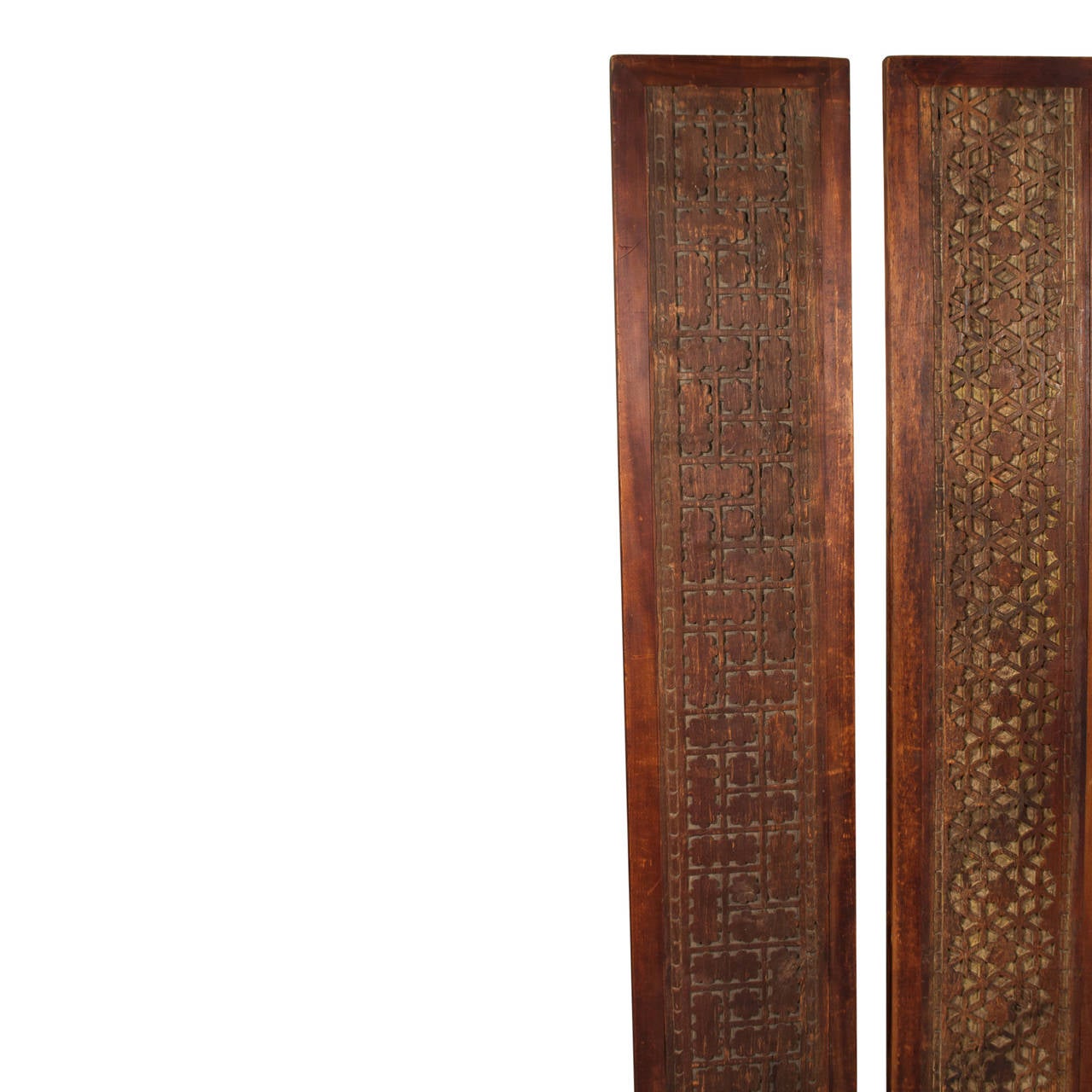 Two architectural panels with geometric relief carvings, Indonesian, 1960s. Height 74 in, width 14 1/2 in, depth 2 in. (sats)