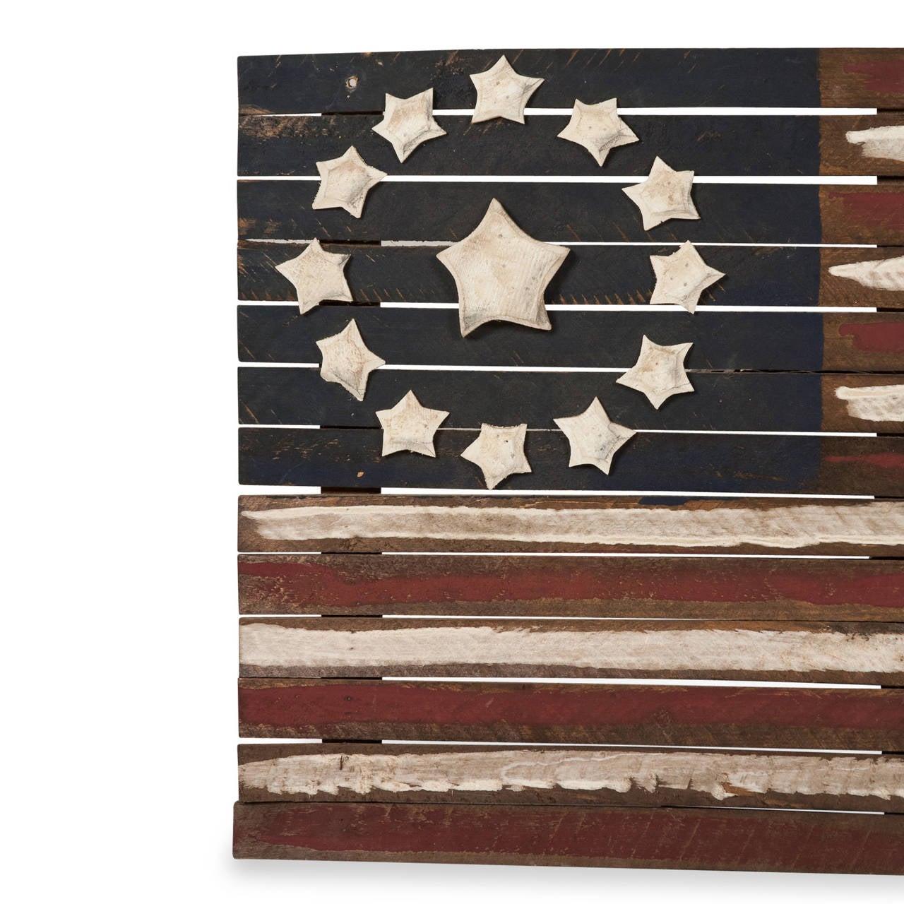 Painted Folk Art scrap wood American flag, with applied cut wood stars in a ring around a larger center star, American, late 20th century. Dimensions: 32 x 19 in, depth 2 in. (Item #2309)