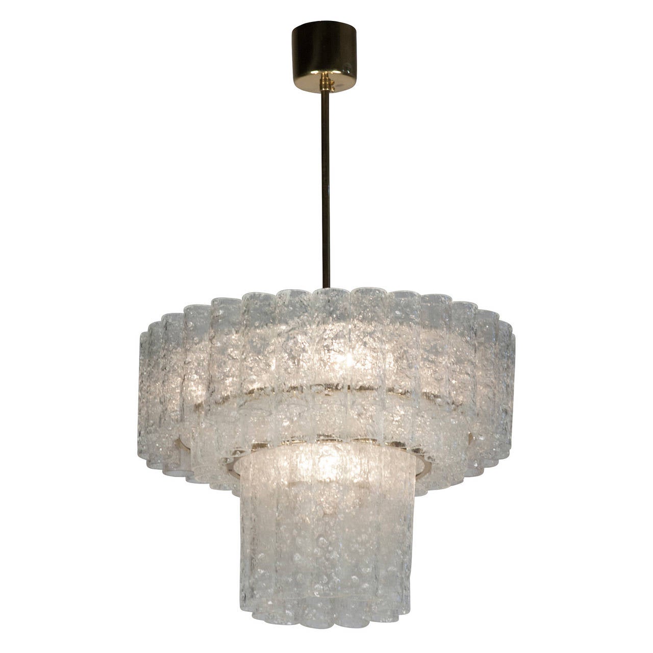 Three tier textured glass chandelier, three rings of glass cylinders suspended from a brass fixture, by Doria, Germany 1960s. Overall height 30 in, height of fixture 14 in, diameter 18 in. (Item #2042)