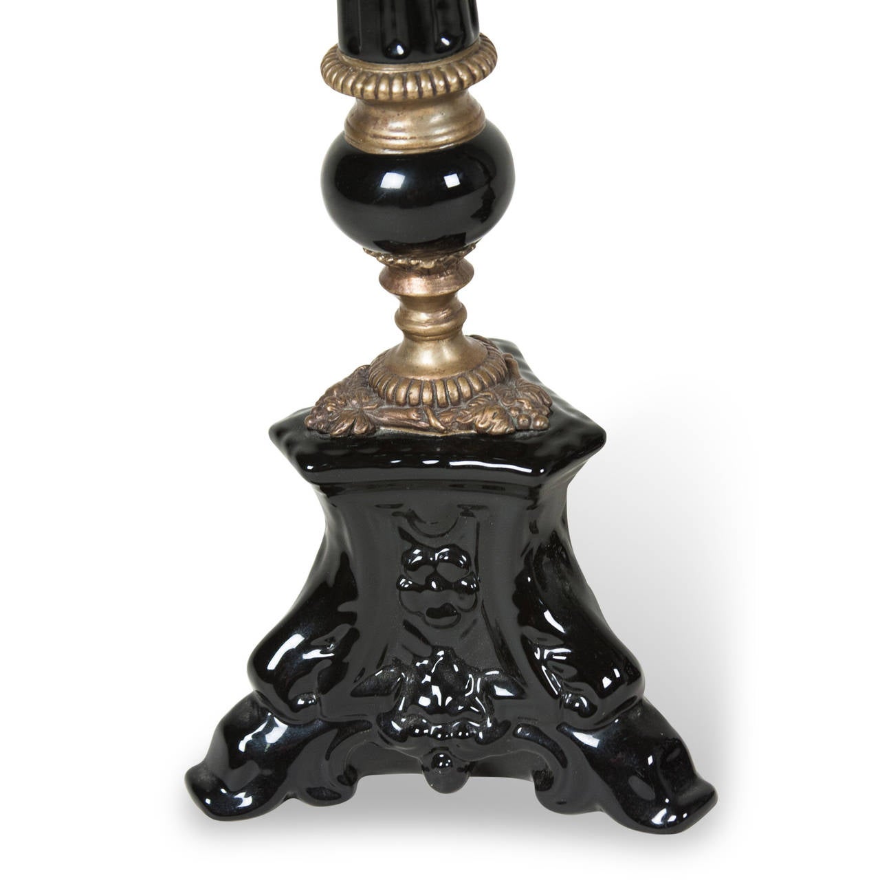 Pair of molded black ceramic candlestick holders, tripod base, tapered column with brass decorative elements, French 1940s. Height 19 1/4 in, width at base 5 1/2 in. (Item #2147)