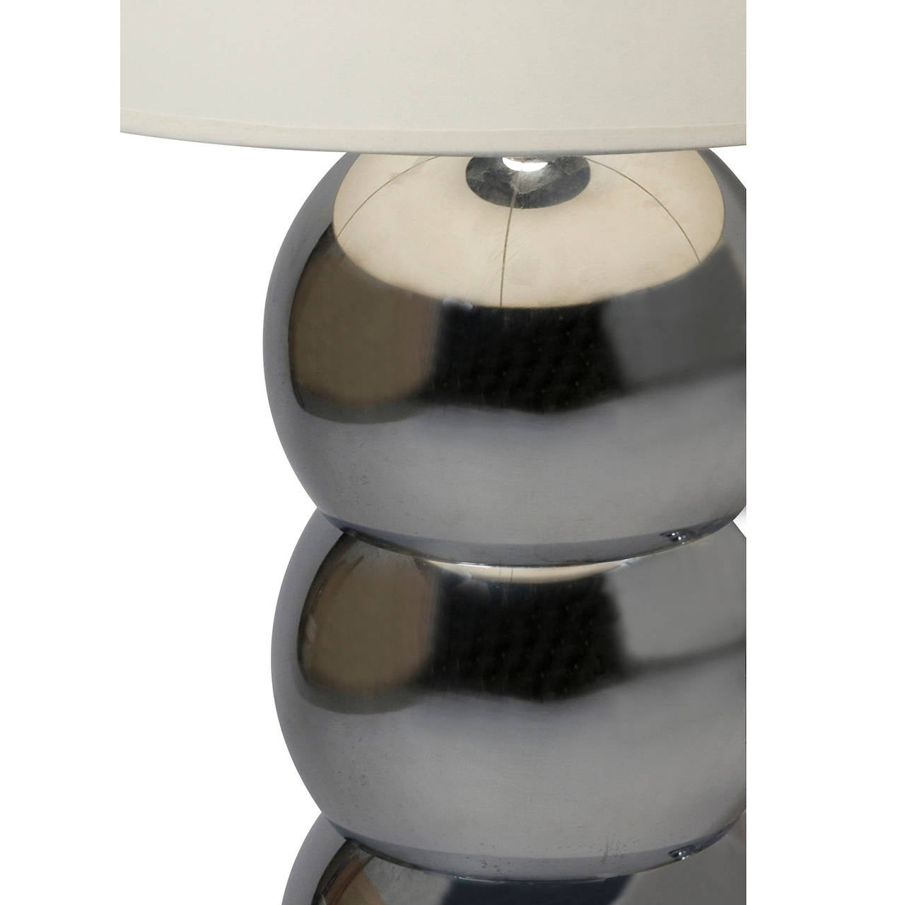Pair of chrome stacked sphere table lamps, with ebonized wood bases. American, 1960s. In custom paper shades. Overall height 36 1/2 in, shade top diameter 14 in, bottom diameter 18 in, shade slant height 15 in, base diameter 7 in. (Item