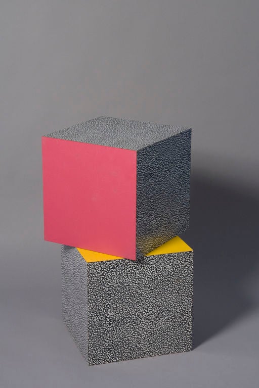 Set of two multi-colored laminated cubes, several sides featuring the distinctive 