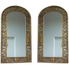 Pair of Bronze Arched Top and Figural Mirrors by Oscar Bach