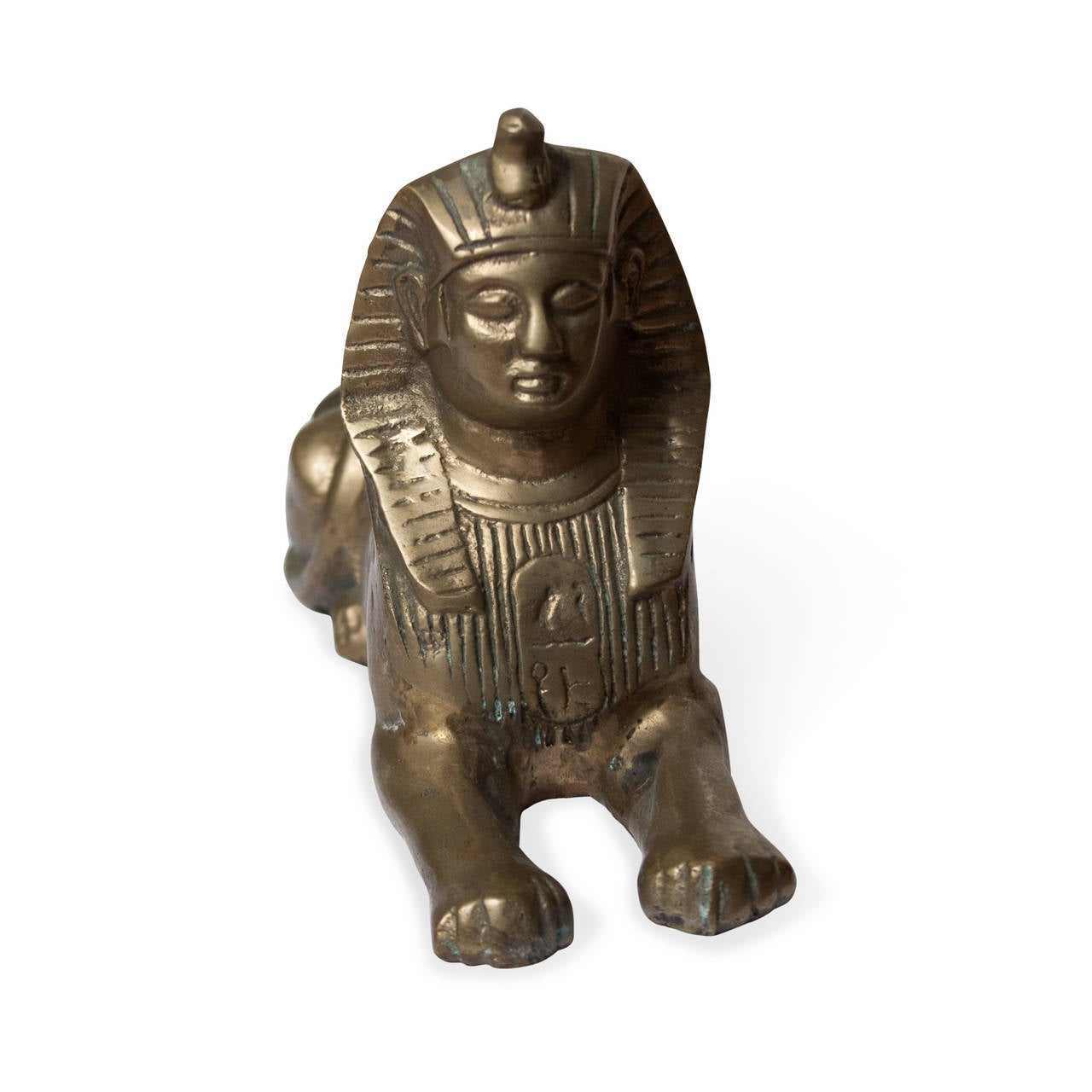 Brass sculpture of a sphinx, American, 1960s. Length 9 in, width 3 in, height 5 1/2 in. (Item #2255) 

Condition: some oxidation.