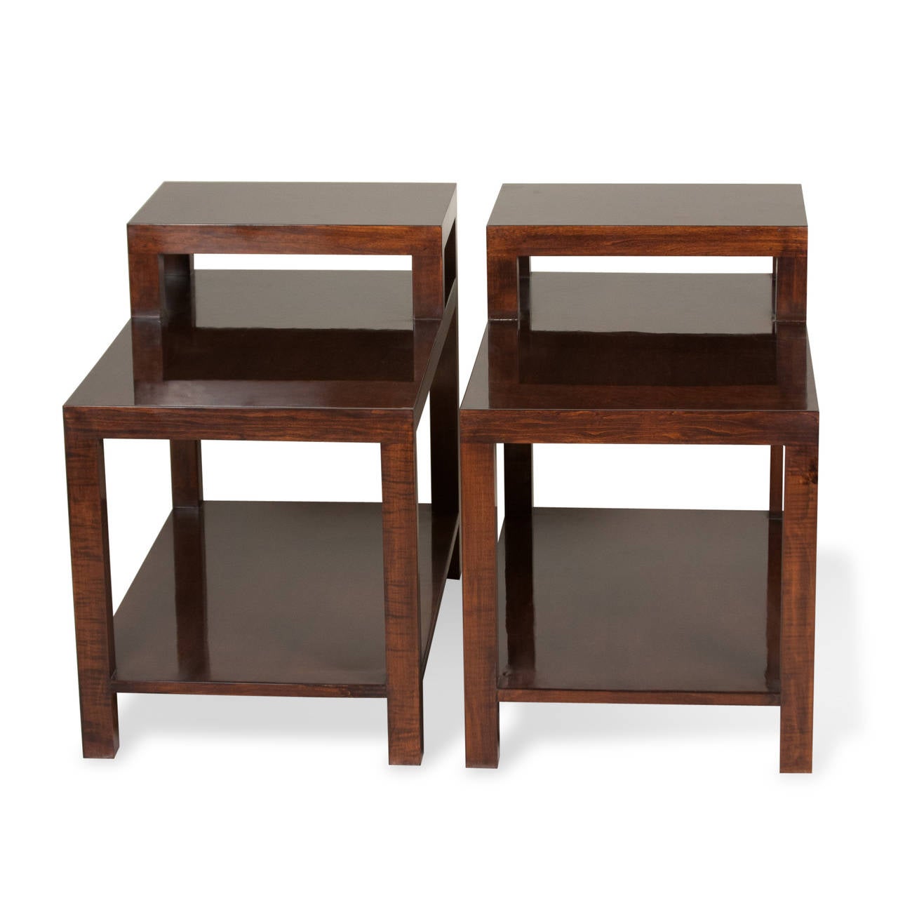 Pair of teak stepped end tables, the legs and supports of squared wooden form, and having lower shelf, by T. H. Robsjohn-Gibbings for Widdicomb, American, 1950s. Measures: 30 in x 18 in, height in back 24 1/2 in, height in front 19 1/2 in. (Item