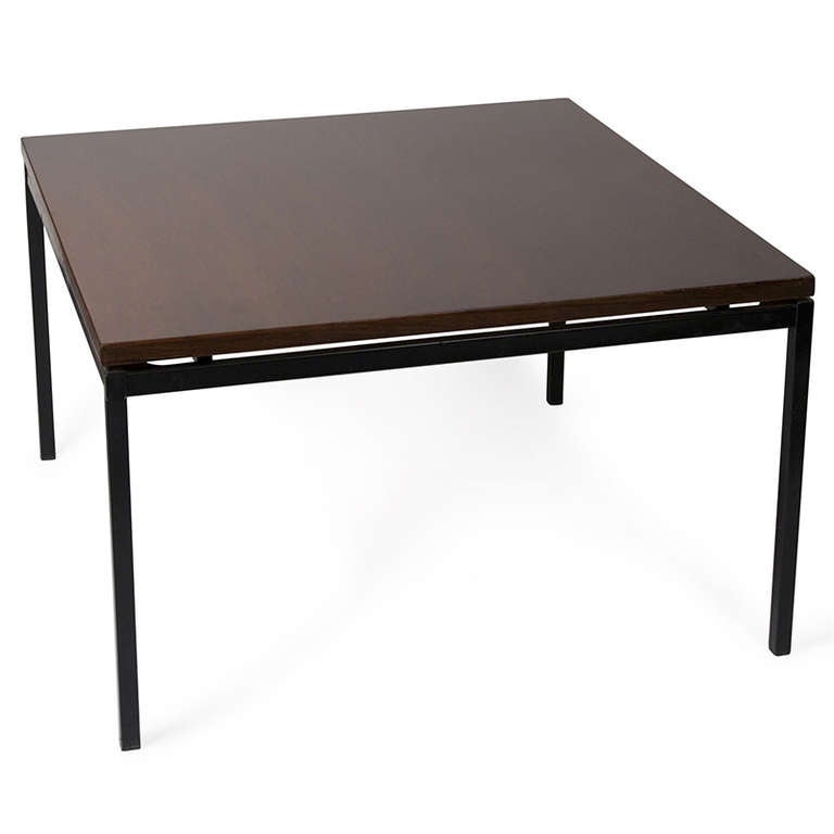 Dark palisander surface coffee table, of square shape, the surface resting on four black lacquered steel legs.By Alain Richard, French, late 1950s. 30 inch square, height 18 in. (Item #1628)