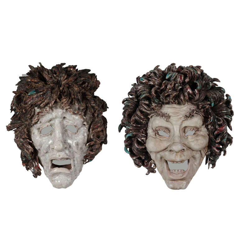 Set of two expressive glazed ceramic heads, one of joy and one of terror, pale white faces, brown curly hair, open mouthes, by Eugenio Pattarino (b.1885-1971), Italian, 1930s. Each signed to backside. Happy: 11 in x 10.5 in x 1.5 in, Sad: 12 in x