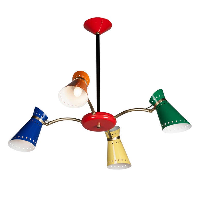 Lacquered metal and brass four-light chandelier, the shades in bright orange, blue, yellow and green, and ceiling canopy and central disc in bright red, each shade with three bands of perforations, and each shade adjustable with a hinge joint.