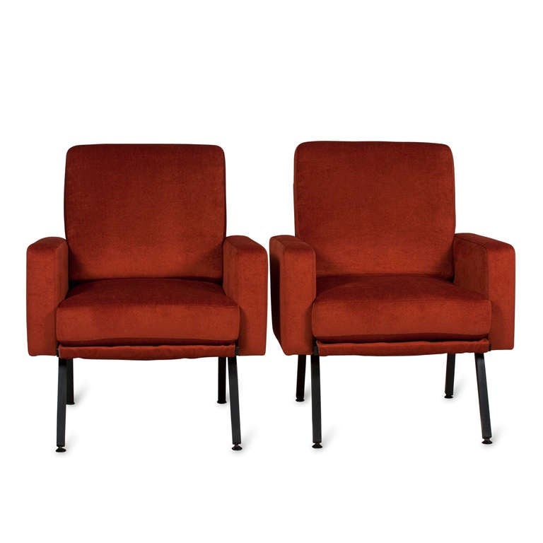 A pair of black steel frame armchairs, block form sides and back raised on four legs, loose seat and loose back, French, 1950s. Newly upholstered in a Kravet chenille blend. Back height 33 in, seat height 17 in, width 27 in, depth 25 in. (item
