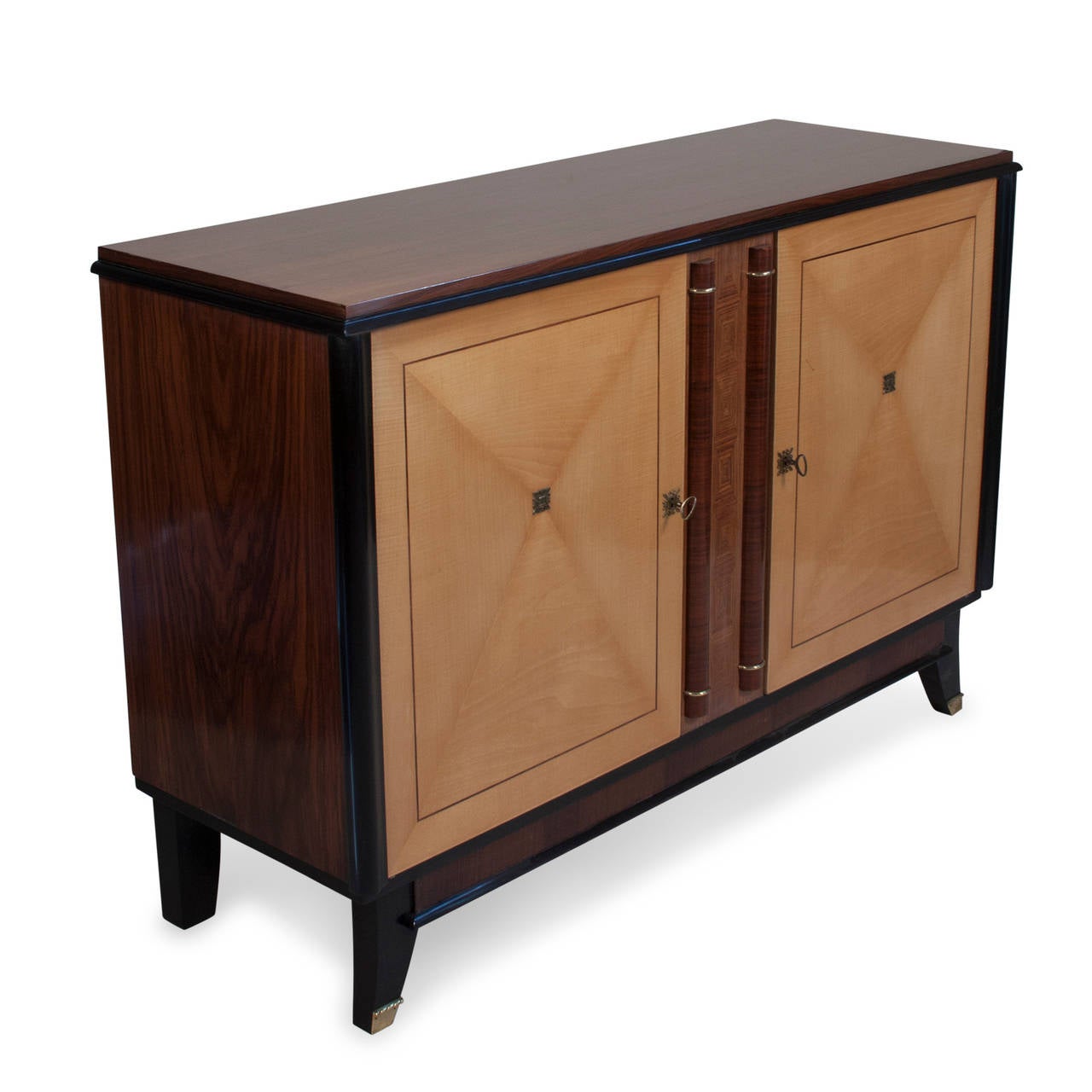 Rosewood, walnut and sycamore two-door cabinet, the sycamore door faces having matched veneer star pattern centered on brass emblem. With ebonized accents and brass keyholes, the top surface and sides beautifully grained rosewood and walnut, the