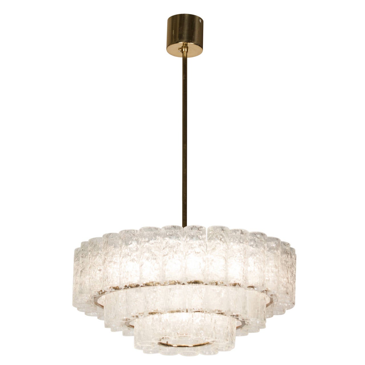 Three-tier textured glass chandelier, three rings of glass cylinders suspended from a brass fixture, by Doria, Germany, 1960s. Overall height 30 in, height of fixture 14 in, diameter 16 in.