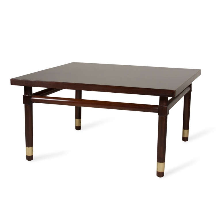 Solid mahogany square coffee table, rounded legs with brass band elements near the bottom, round stretchers between the legs, by Widdicomb, American, 1950s. 31 in square, height 16 1/2 in. (Item #2139)