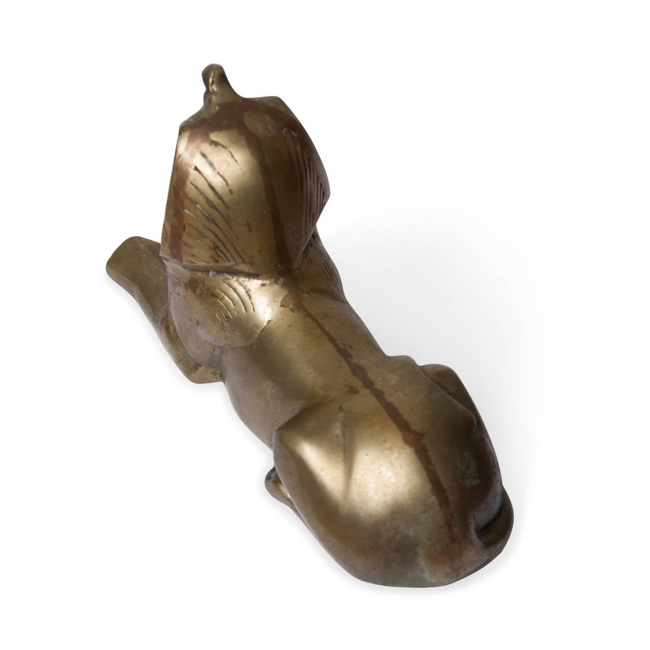 Brass sculpture of a sphinx, American 1960s. Length 9 in, width 3 in, height 5 1/2 in. (Item #2255)

Condition: some oxidation.