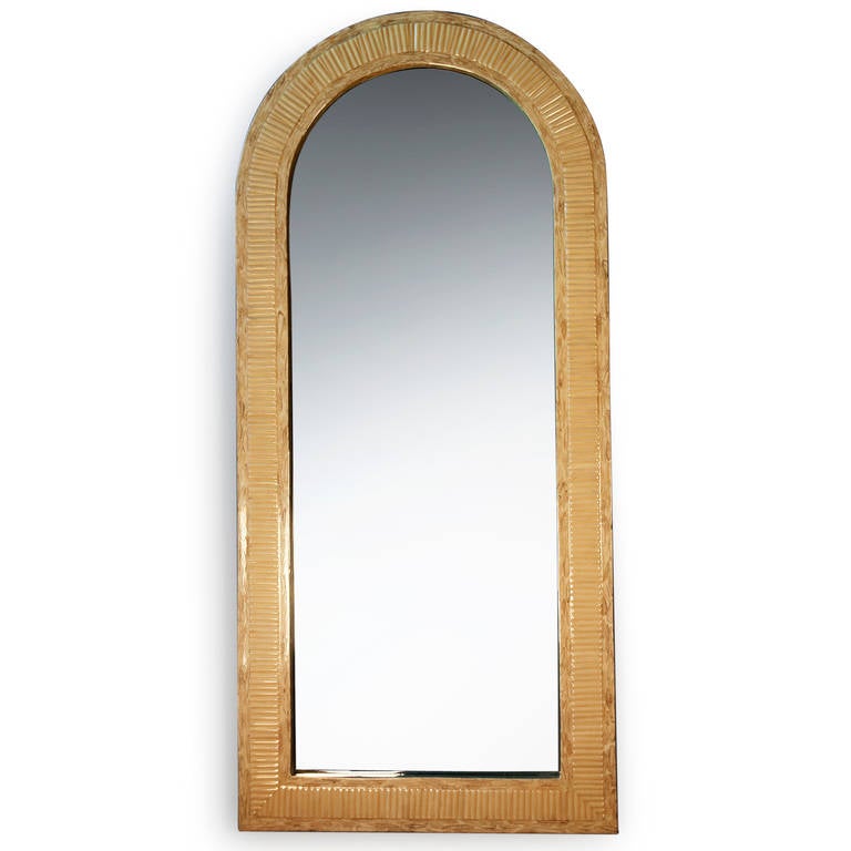 Rectangular arch top bone color lacquered mirror, the frame with ripple texturing, by Enrique Garcez, Columbian for the American market, circa 1980, in the style of Karl Springer, marked to backside. 66 1/2 in x 30 1/4 in, depth 1 1/2 in.