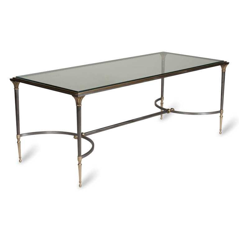 Bronze frame glass top coffee table, with double U-shaped stretcher and neoclassical style column legs, by Maison Charles, French, 1960s. Dimension: 48 in x 20 in, height 18 in.