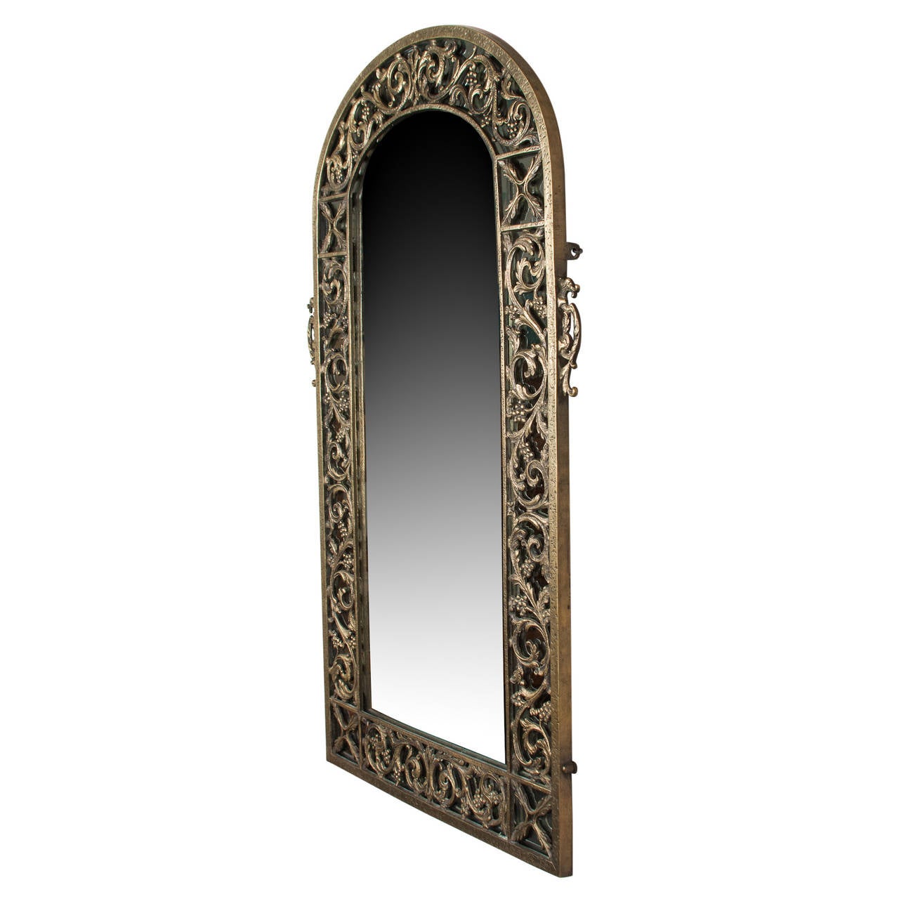 Bronze articulated frame mirror, with vine and acanthus leaf decoration, rounded top, rectangular bottom, by Oscar Bach, American 1920s. Height 35 in, width 21 1/2 in. (Item #2259 sats)